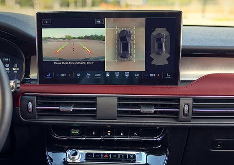 The driver of a 2024 Lincoln Corsair® SUV is shown selecting the drive mode. | Stivers Lincoln in Waukee IA