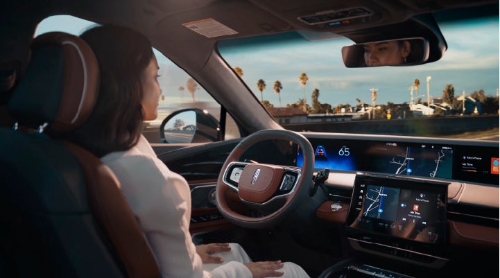 A person is shown driving hands-free on the highway with available Lincoln BlueCruise technology. | Stivers Lincoln in Waukee IA